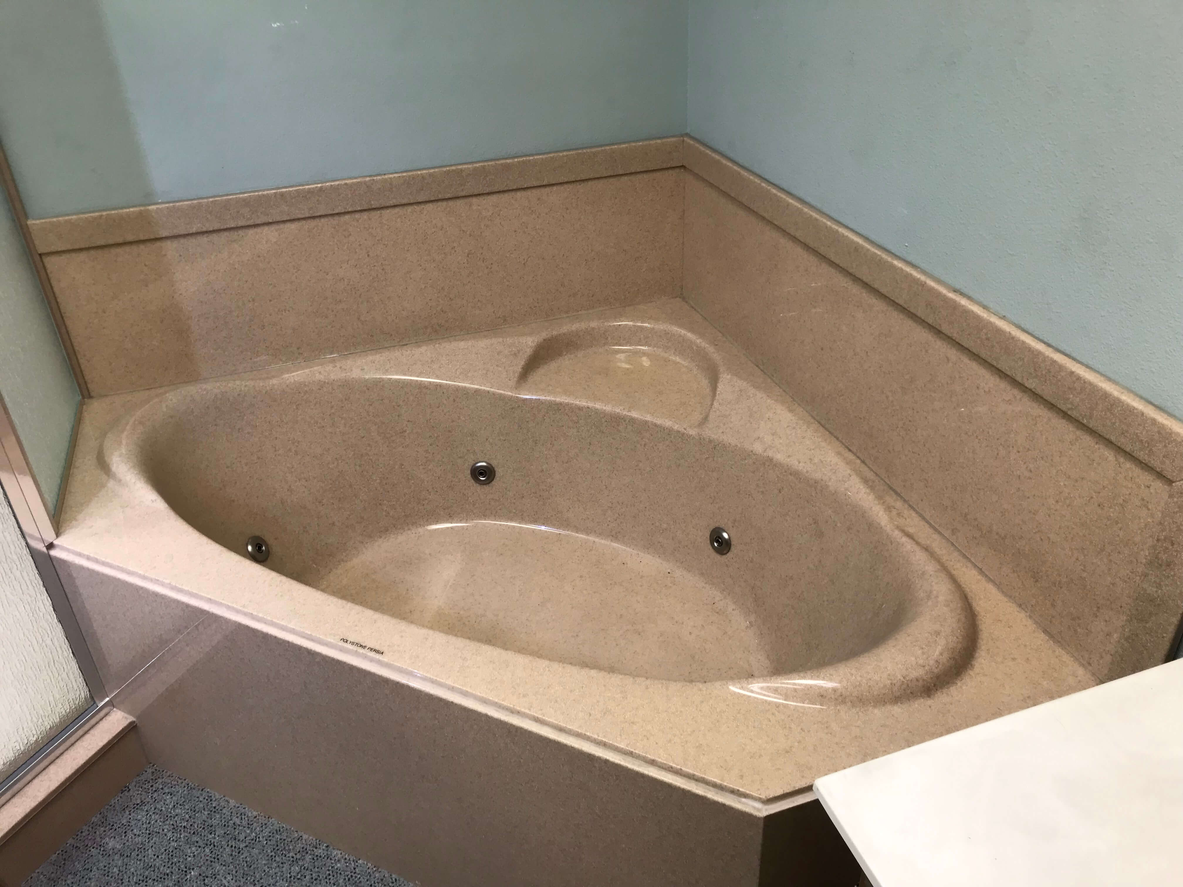 granite corner tub with surround